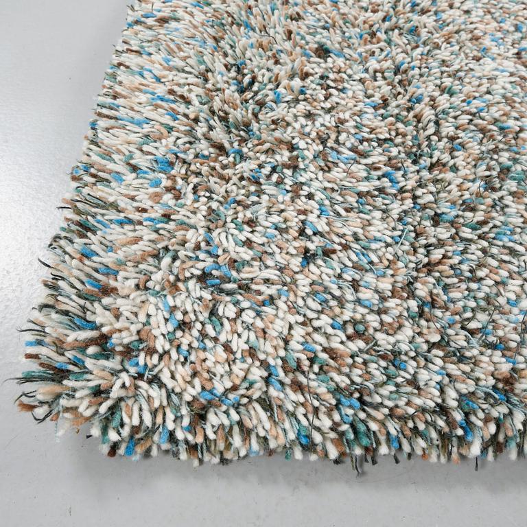 A rug by Gunilla Lagerhem Ullberg, Kasthall, 302 x 123 cm.