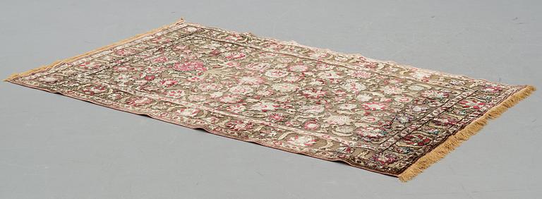 A carpet, an antique silk metal brocaded Kashan, probably around 1910, ca 200-202,5 x 129-131 cm.