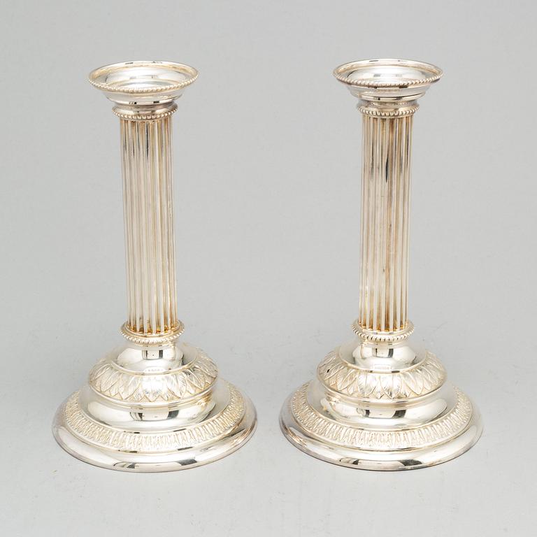 A pair of silver plated candle sticks.