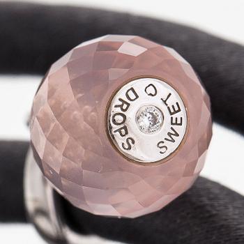 Ole Lynggaard, A silk, rose quartz, diamond 0.015 ct and 18K white gold bracelet. Denmark.