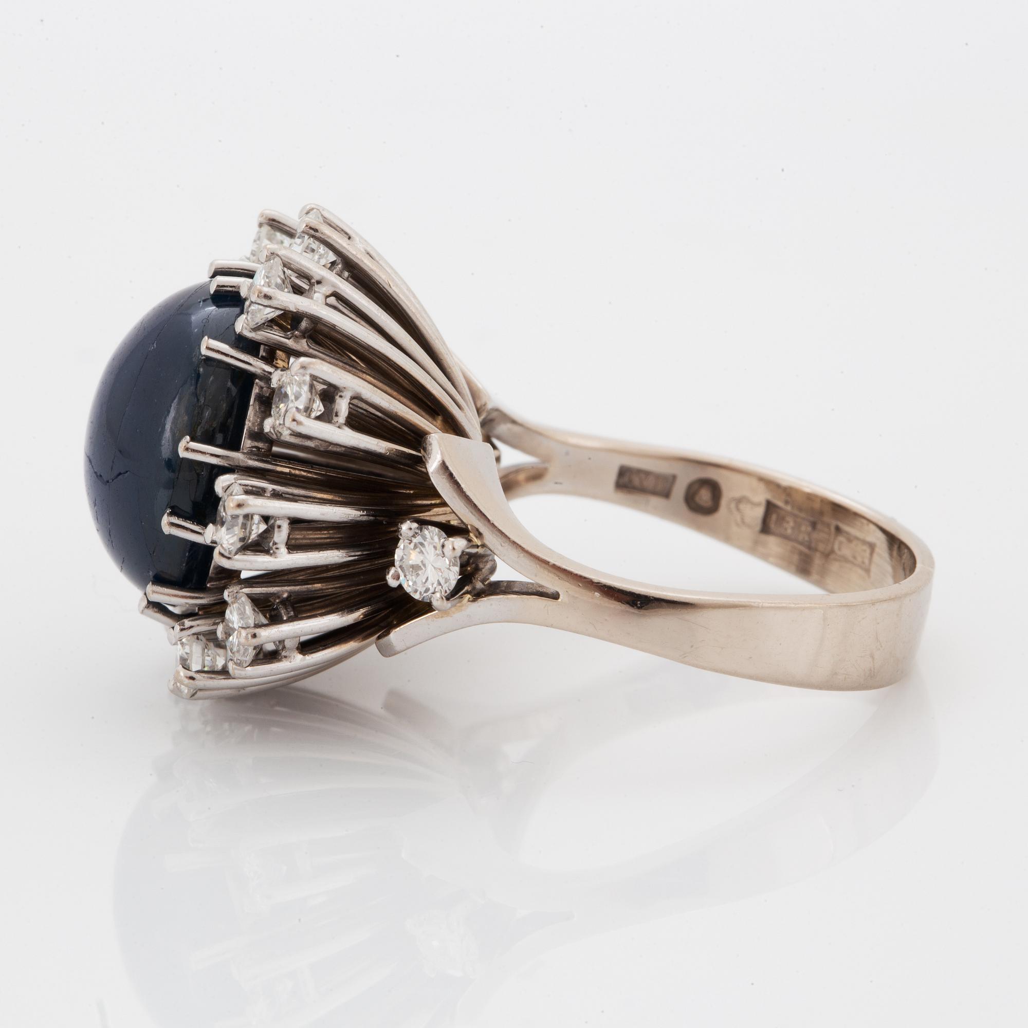 Cabochon-cut sapphire and brilliant-cut diamond cocktail ring.