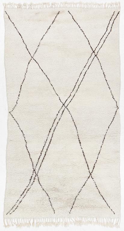 A Moroccan carpet, c. 282 x 150 cm.