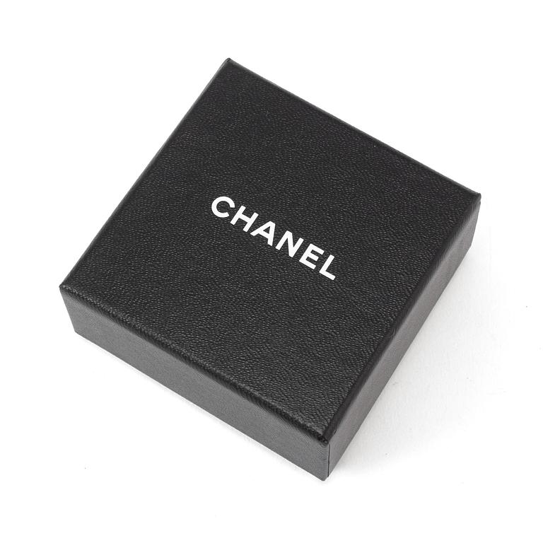 A necklace by Chanel.