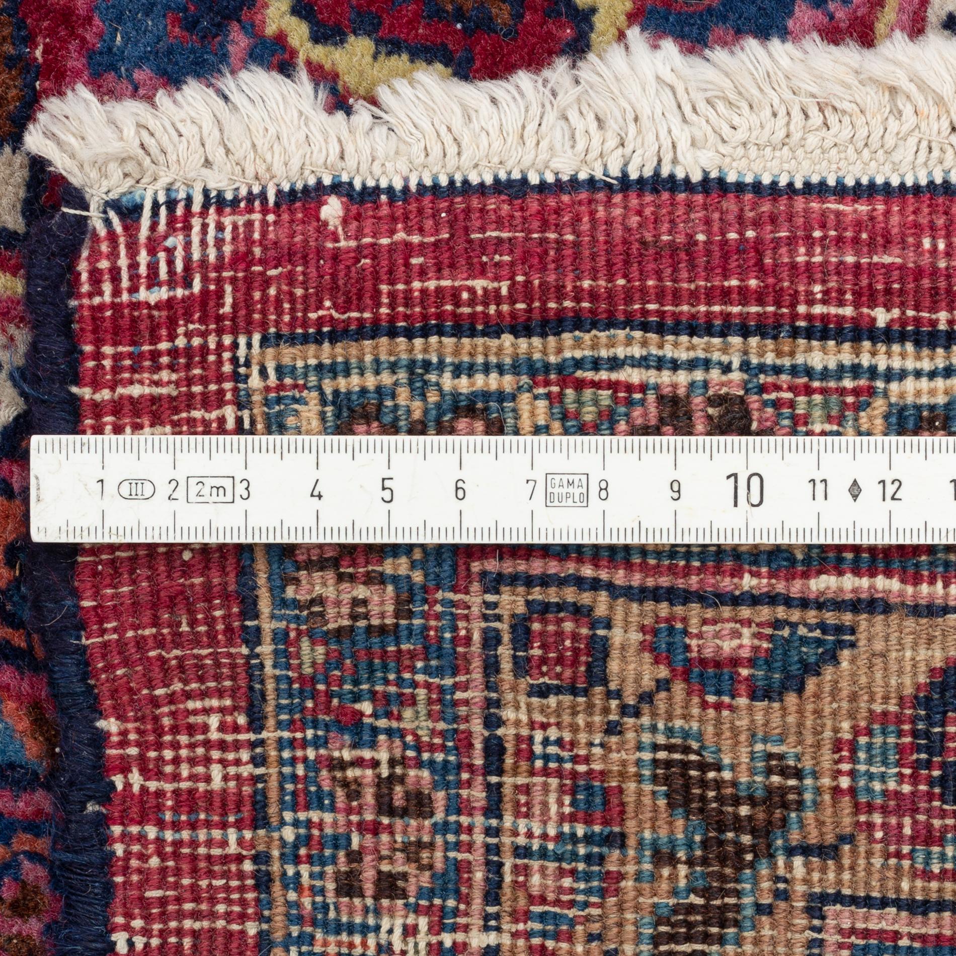 A Meshed carpet, c. 405 x 320 cm.