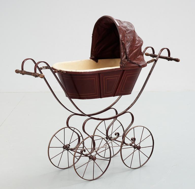 A 19th/20th century doll's pram.