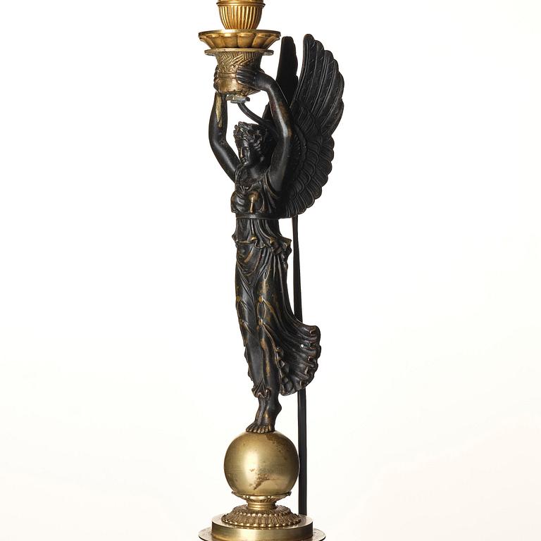 A French Empire ormolu and patinated bronze table lamp, early 19th century.
