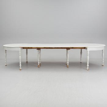 A mid 19th century dining table with six extension leaves.