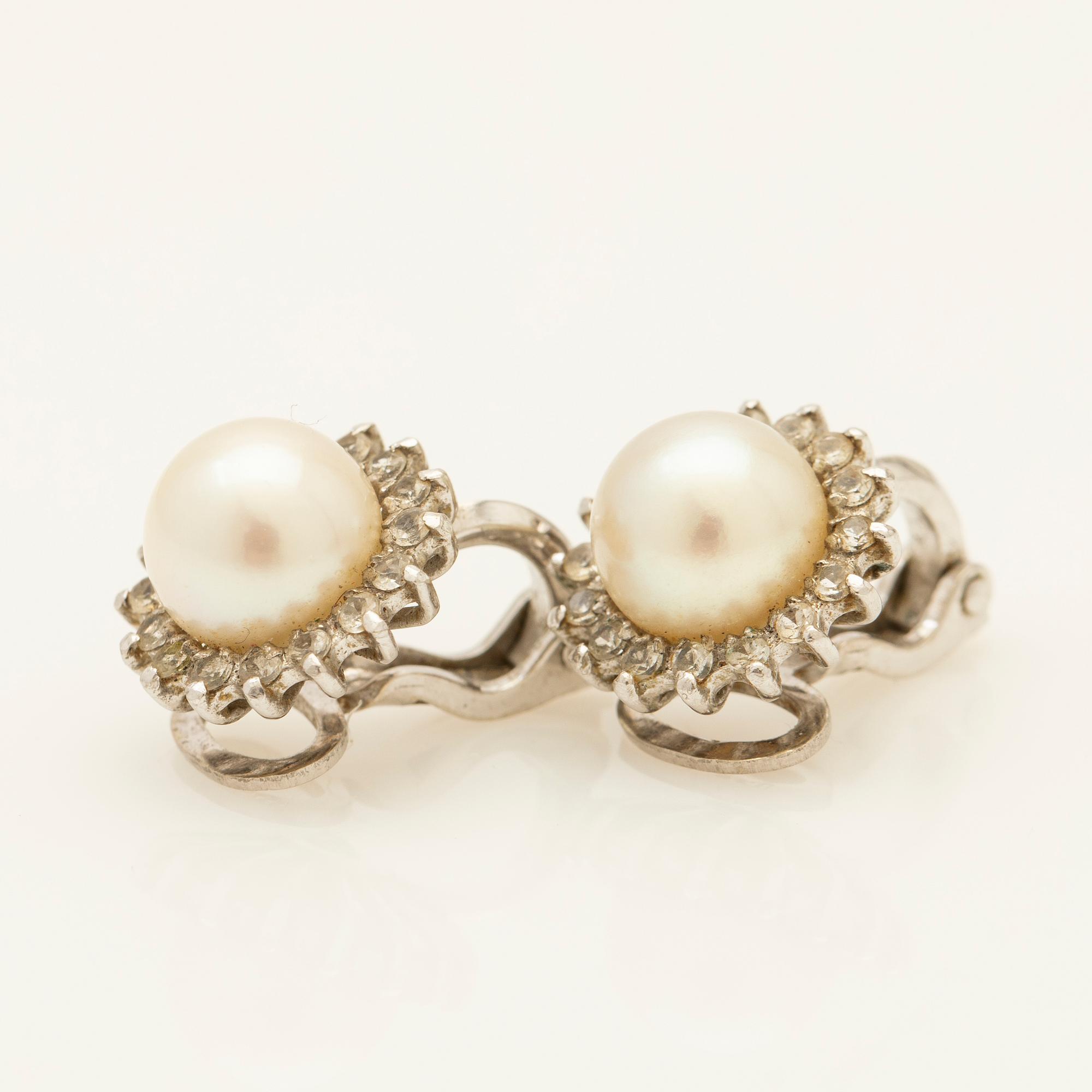 Earrings, a pair, 18K white gold with pearls and diamonds.