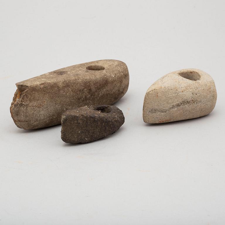 Three neolithic stone axes.