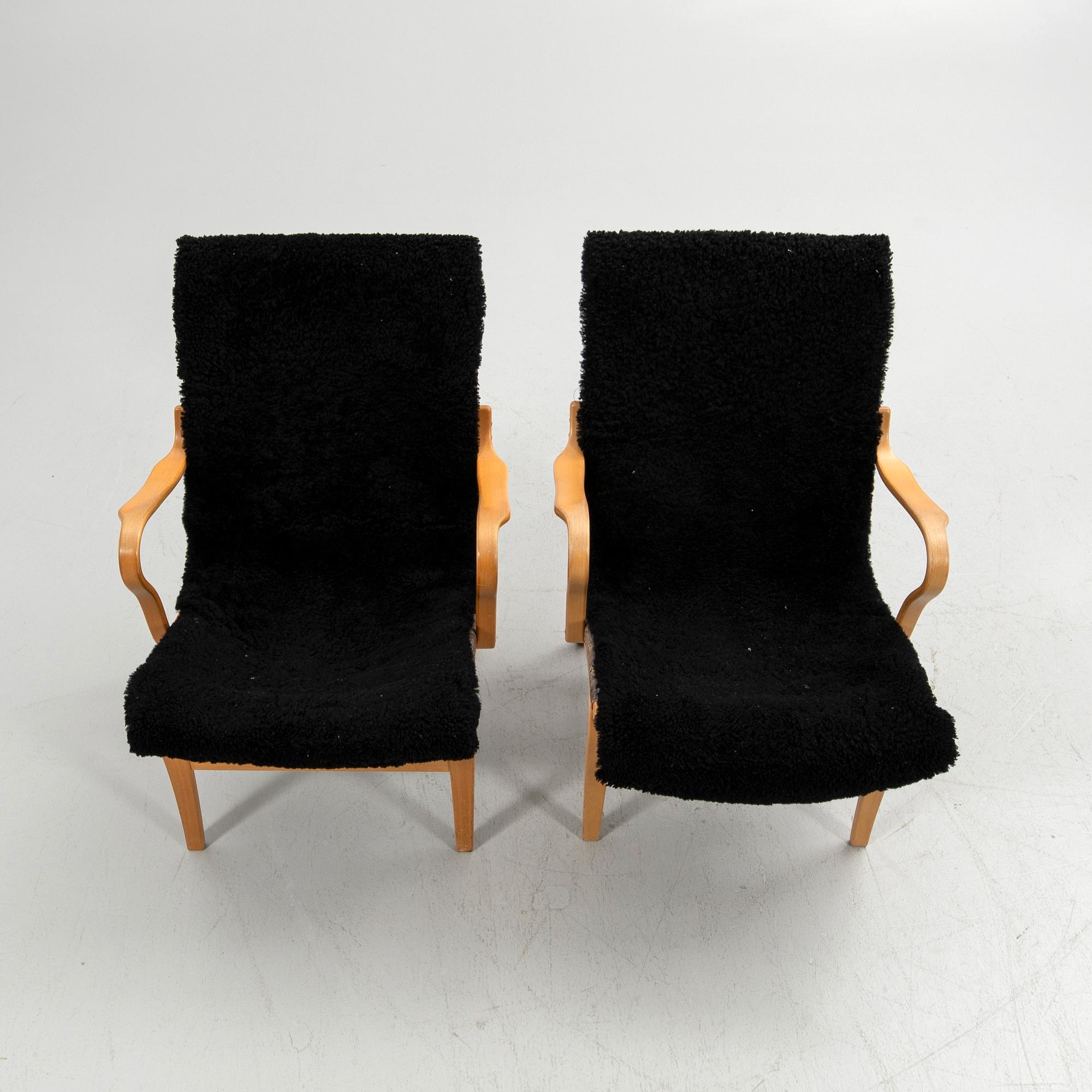 Bruno Mathsson, armchairs, a pair, "Eva", Bruno Mathsson International, Värnamo, second half of the 20th century.