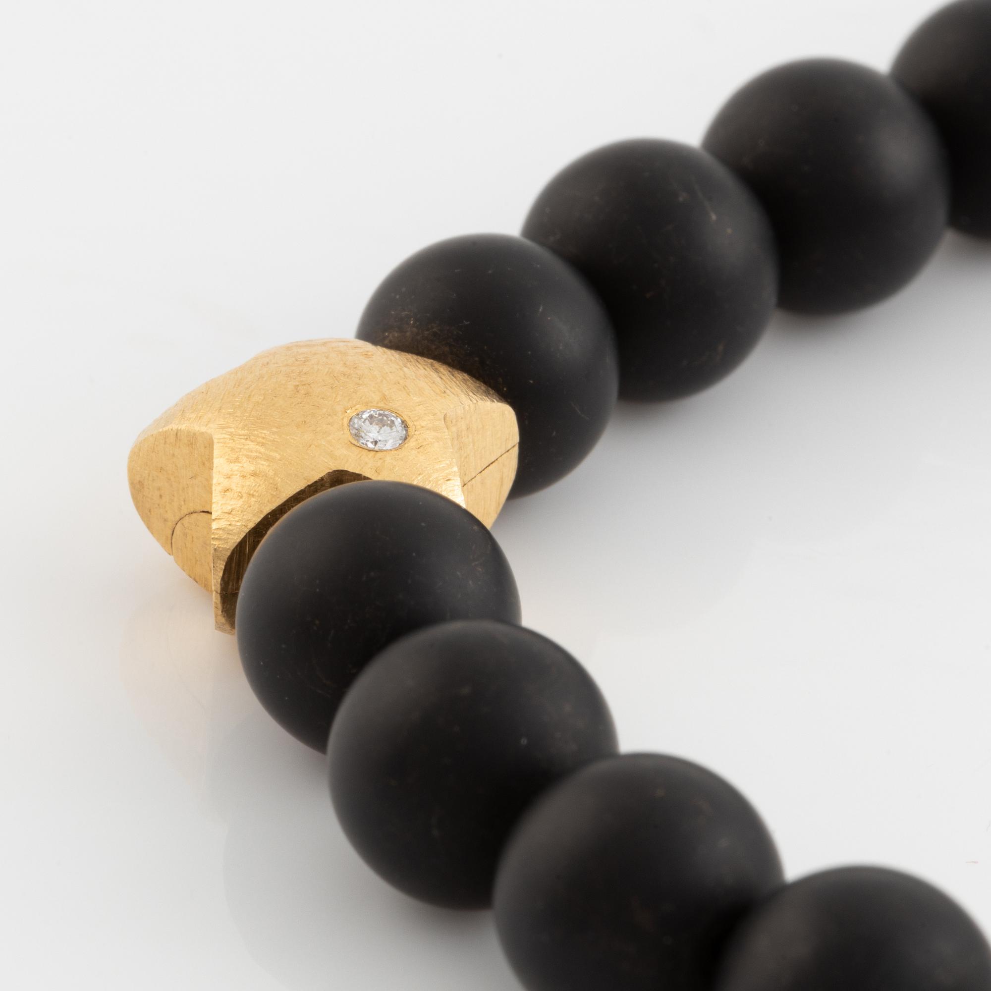 Ole Lynggaard, black stone  bead necklace, clasp star 18K gold with brilliant cut diamond.