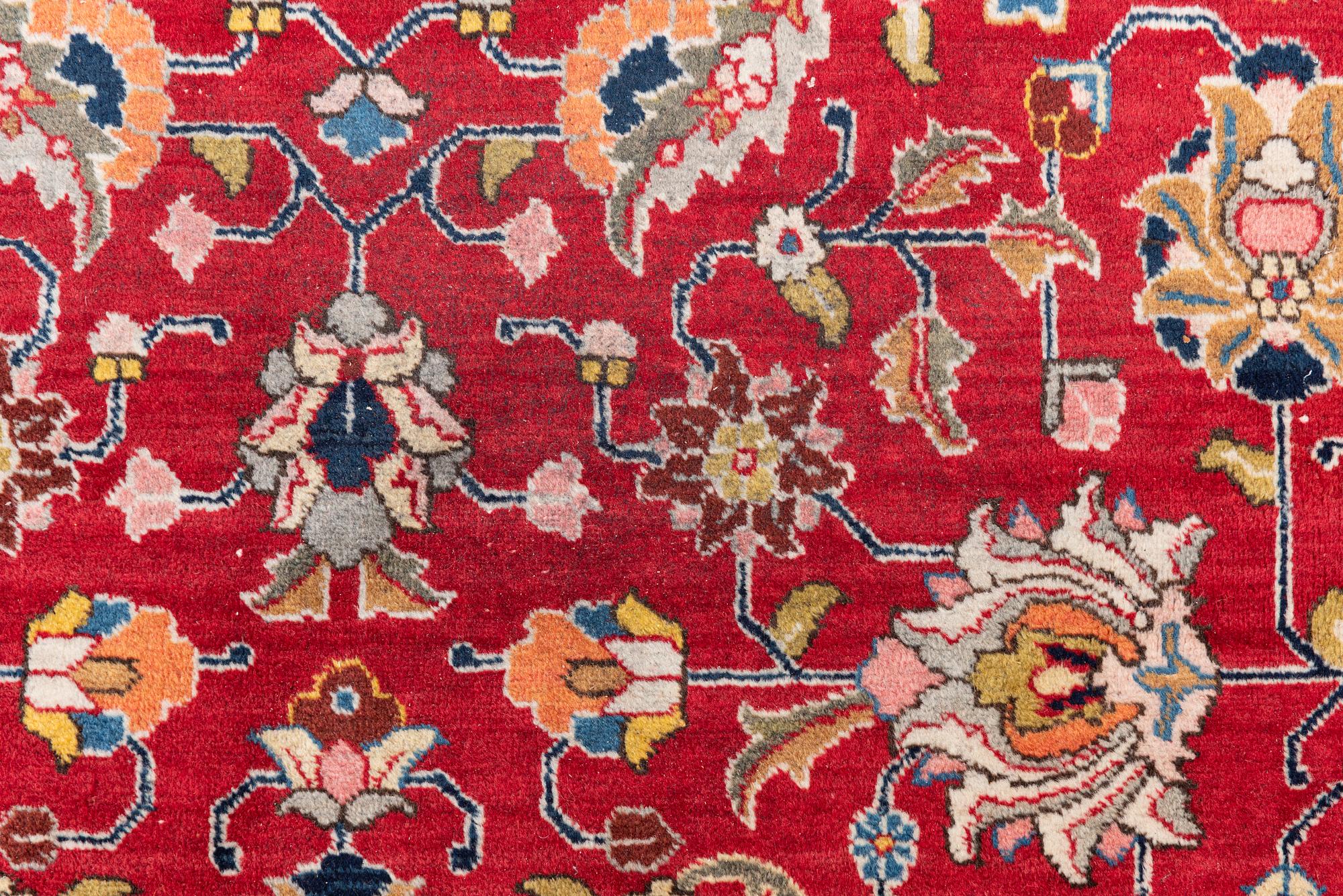 A semi-antique Tabriz carpet, c 358 x 248 cm.