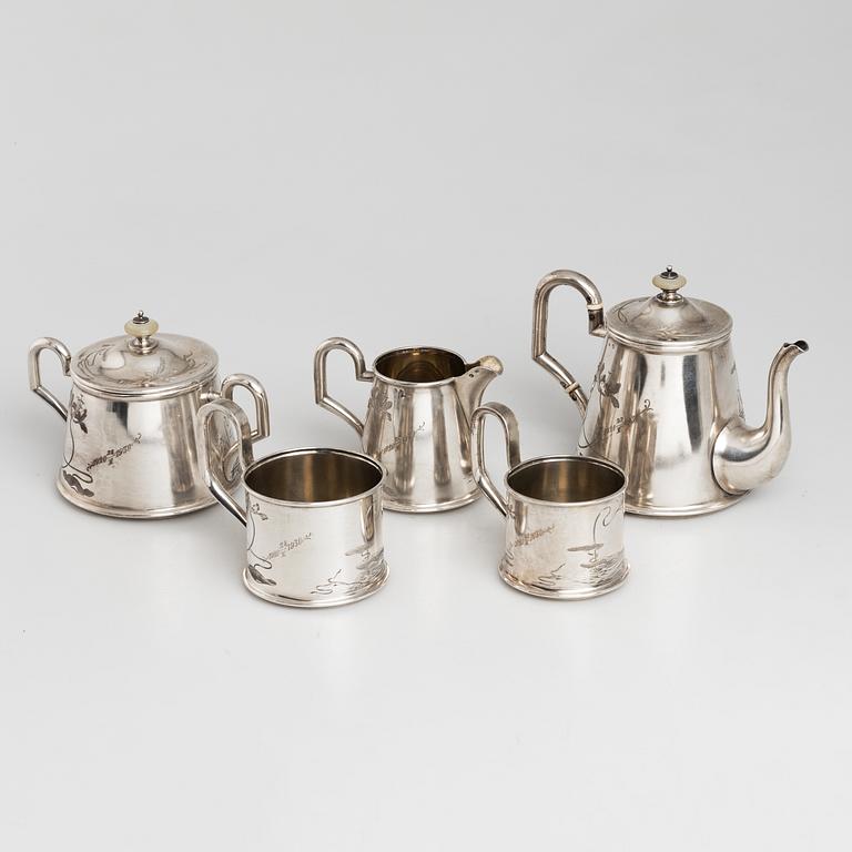 A five-piece Russian parcel-gilt tea set, maker's mark B.A. for Vasili Andrejev or Vasili Akimov, Moscow, 1898-1914.