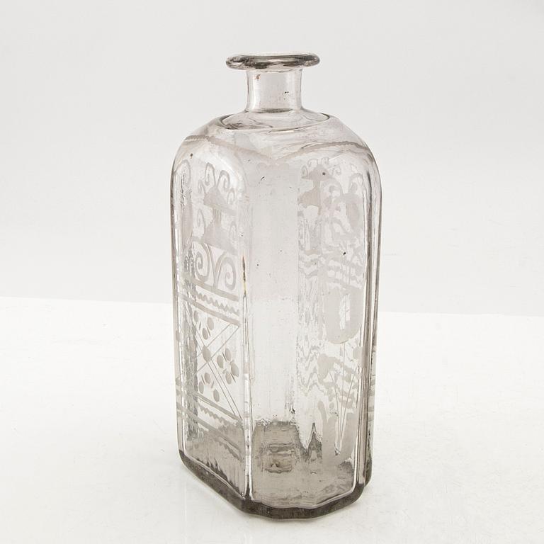 Flaska, glas. Troligen Skånska glasbruket, 1700-tal.