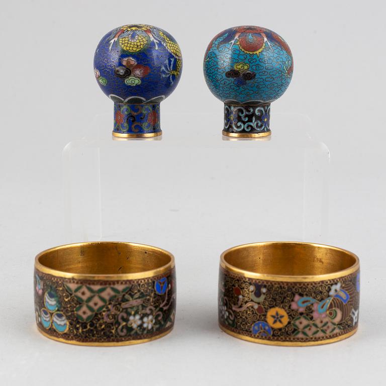 Two cloisonné cane tops and two napkin rings, China, first half of 20th Century.