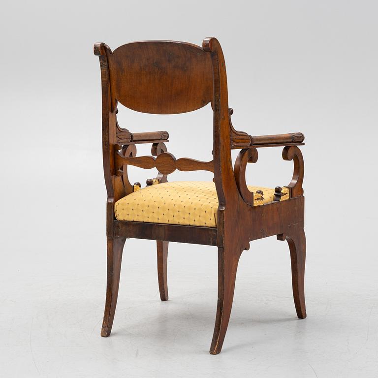 A Russian/Baltic Empire mahogany armchair, first part of the 19th century.