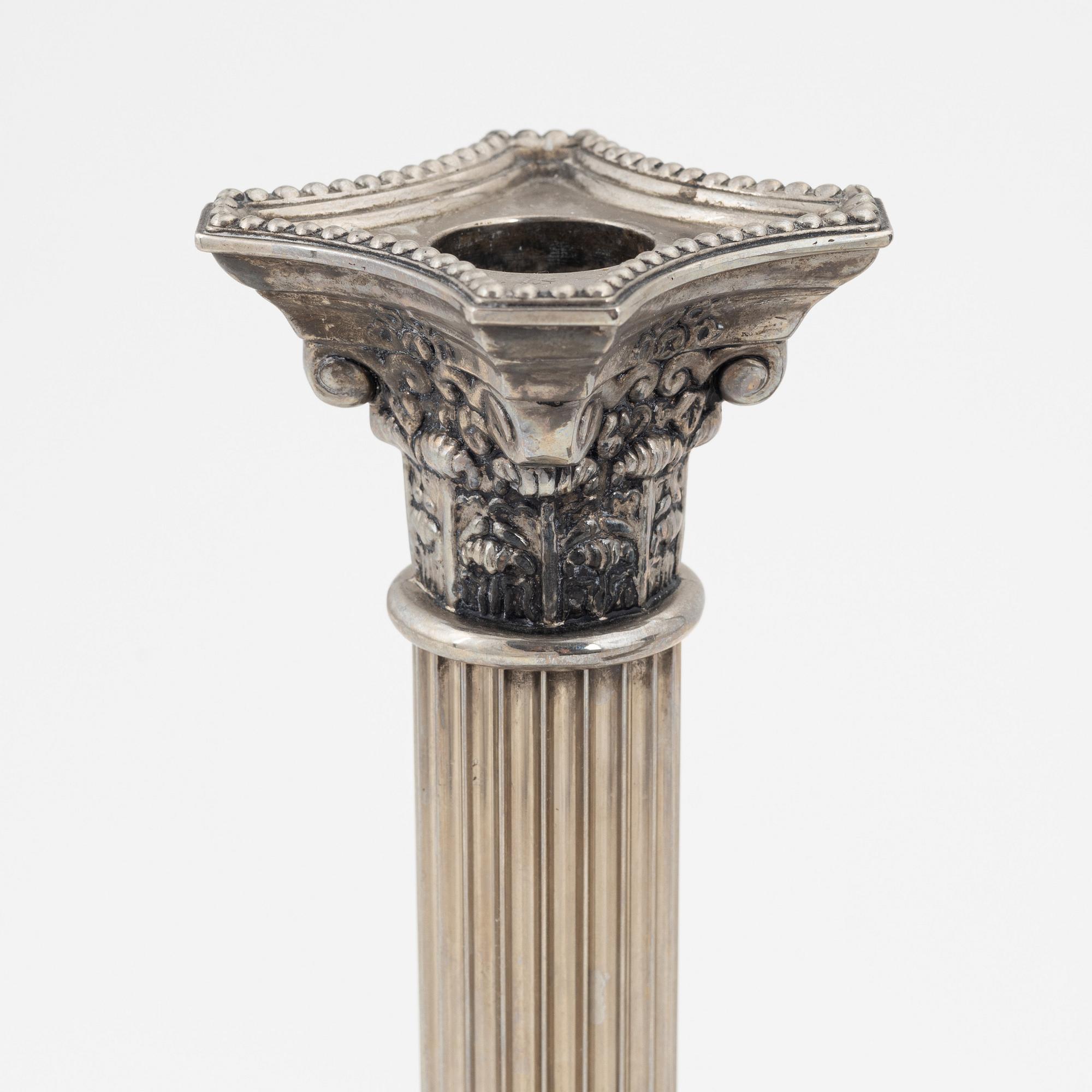 A pair of silver plate Godinger Silver candle holders, 1992.