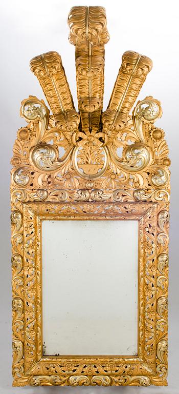 A MIRROR, Baroque style, circa 1900, gilt wood.