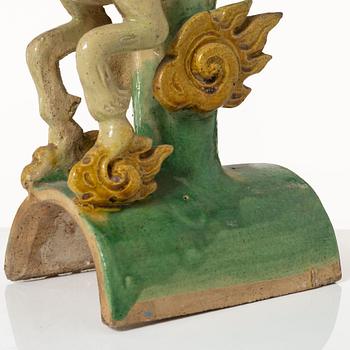 A set of two green and yellow glazed roof tiles figures of flying horses, Qing dynasty.