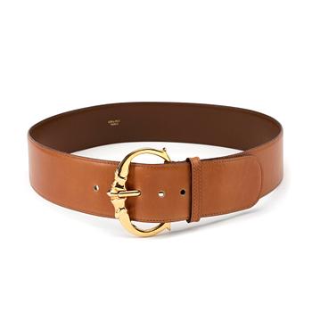 381. CÉLINE, a brandy coloured leather belt.