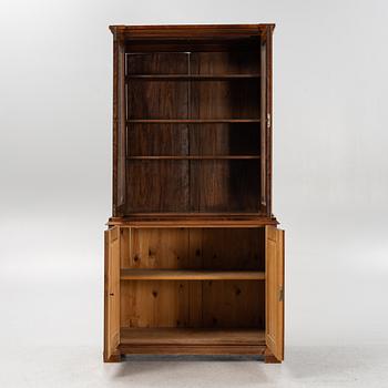 A walnut veneered book cabinet, second part of the 20th Century.