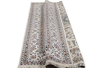 A carpet, Nain, part silk, ca. 345 x 246 cm.