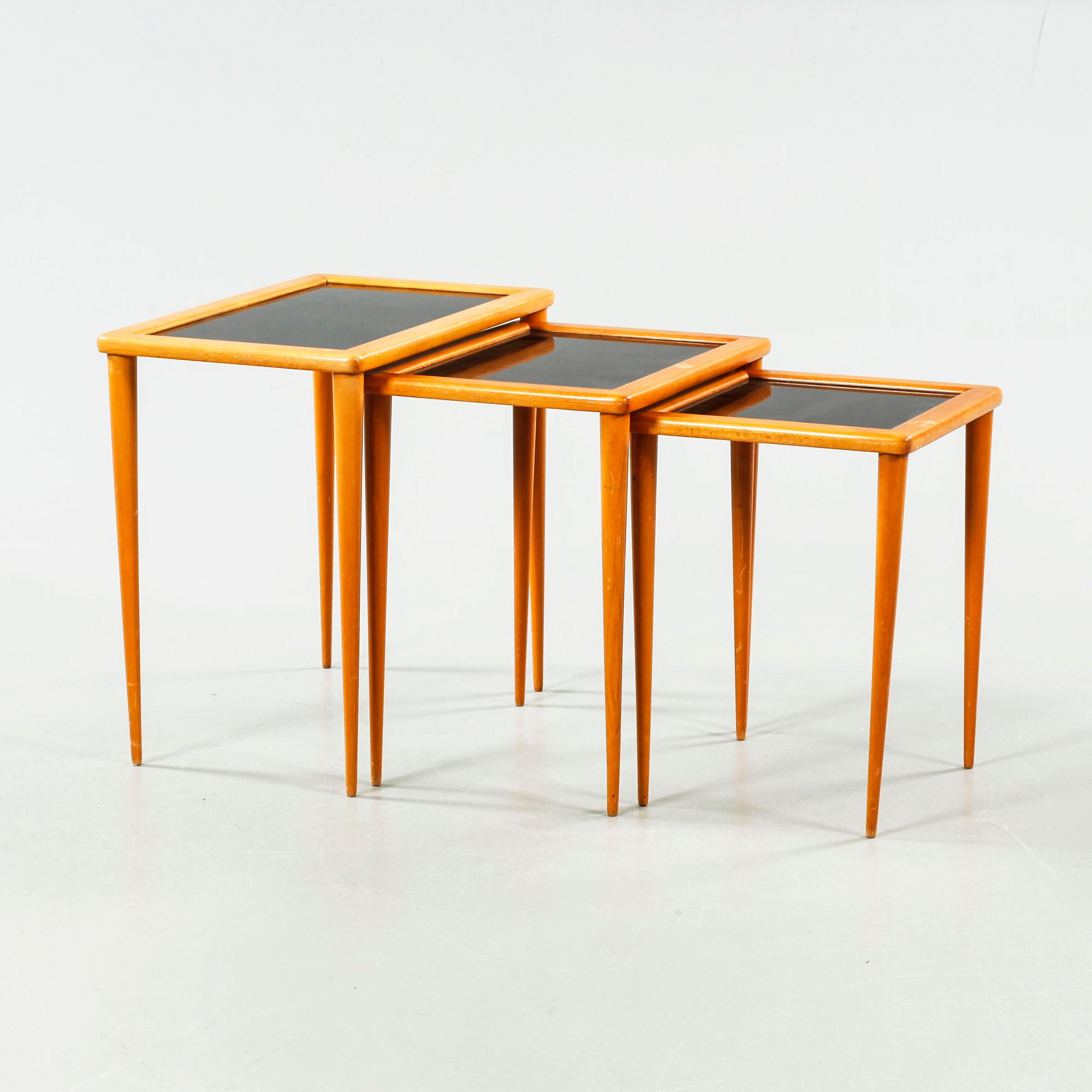 An nest of table of three pieces from the second half of the 20th century.