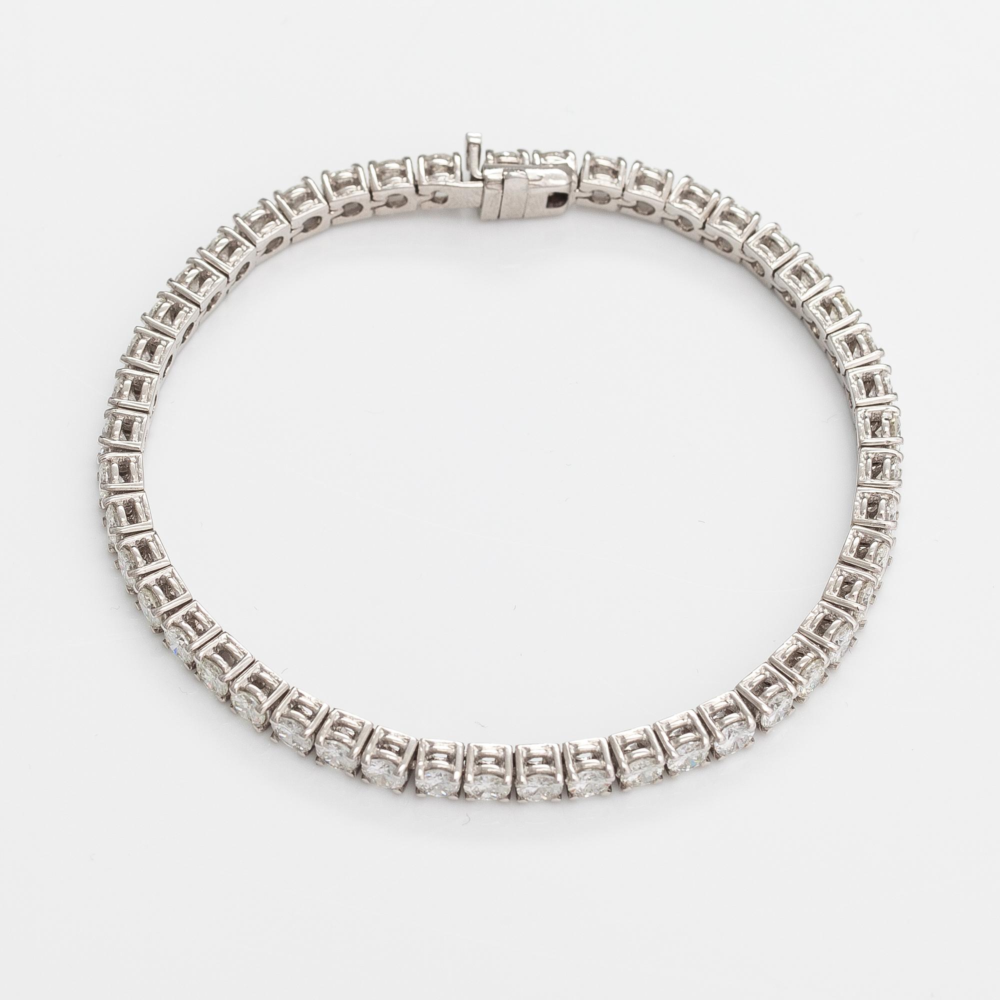 Tennisrannekoru, 18K valkokultaa, briljanttihiottuja timantteja n. 7.00 ct yht.