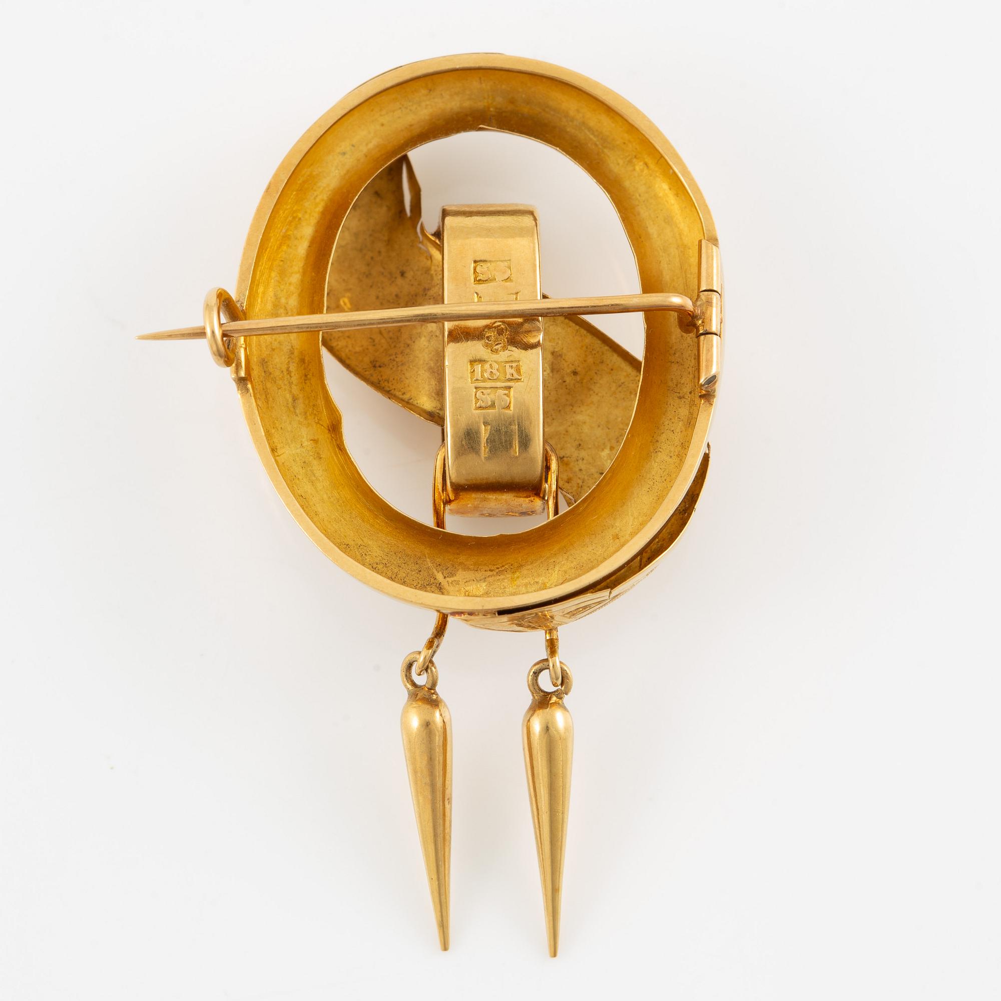 Brosch 18K guld.