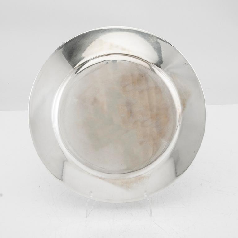 A set of 12 silver plates mark of GAB Stockholm 1963, total weight 6000 grams.