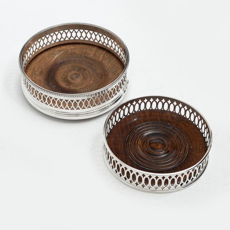 Two English silver coasters, mark of E Edmonds, Birmingham, 1930 and C J Vander Ltd, London 1969.
