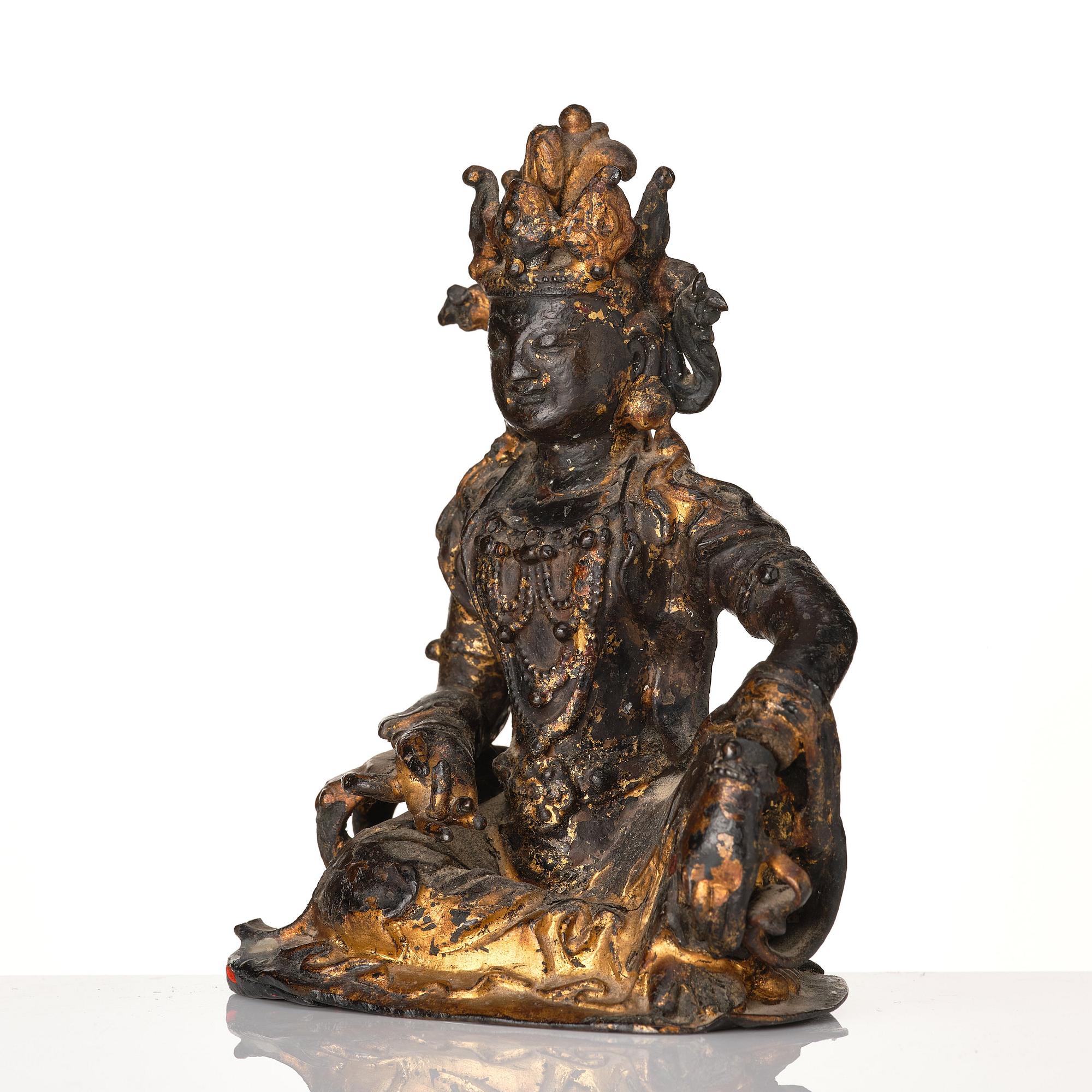 A cold gilt bronze figure of Avalokitshvara, Ming dynasty.