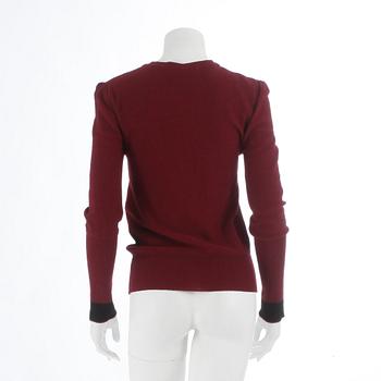 SONIA RYKIEL, a burgundy red wool sweater.