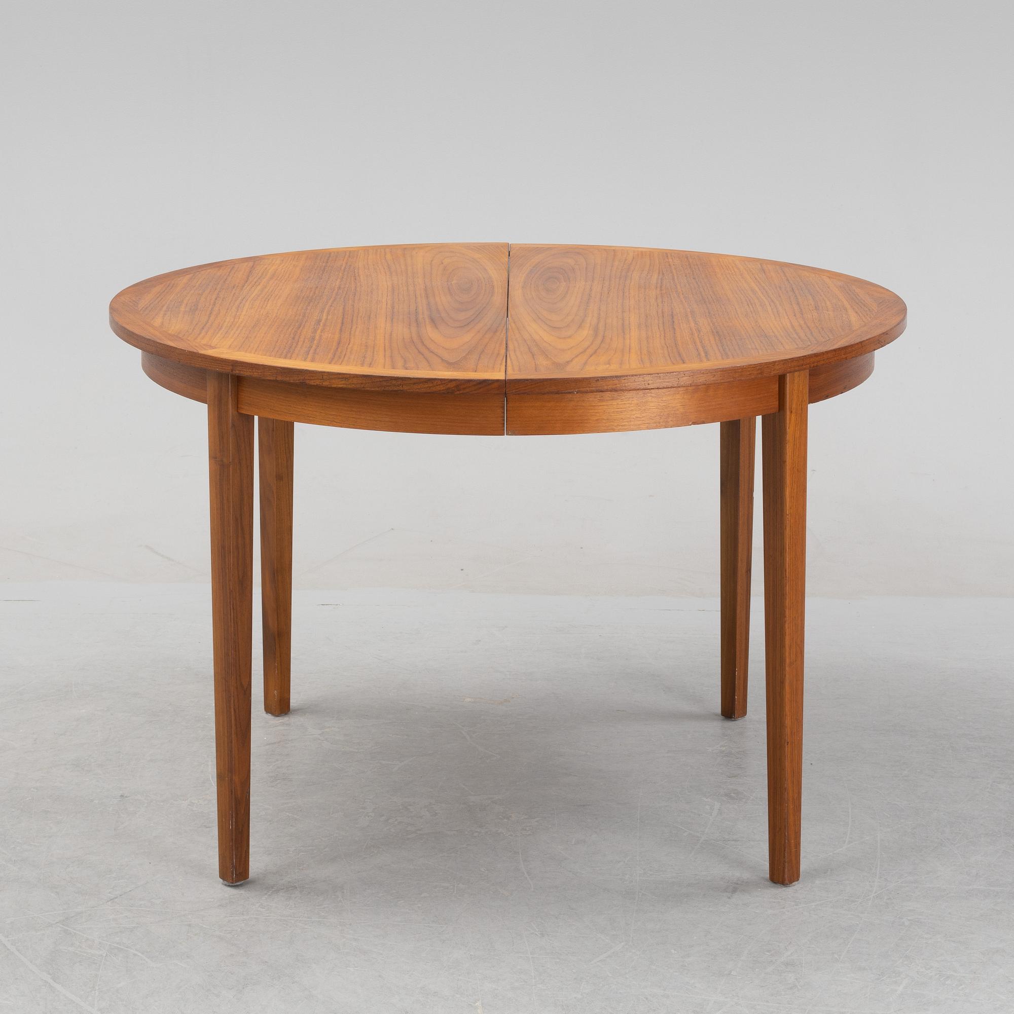A teak veneered dining table, 1960's.