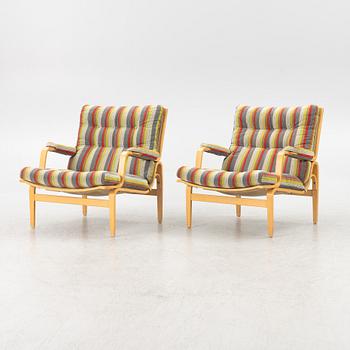 Bruno Mathsson, a pair of "ingrid" armchairs, Dux, Sweden, second half of the 20th century.