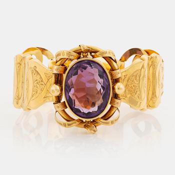 535. An 18K gold bracelet set with a faceted amethyst, by G Möllenborg.