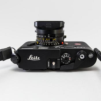 a black body Leica M4-P camera with no 1605951 made by Leitz Canada in 1982. With two lenses and a Leica Meter.