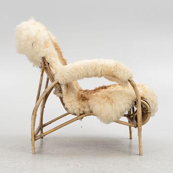 A Scandinavian cane armchair, mid 20th century.