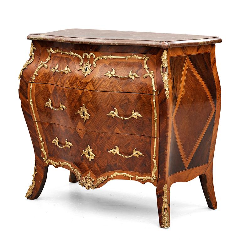 A Swedish Rococo 18th century commode in the manner of Johan Jacob Eisenbletter (ebenist in Stockholm ca 1760).