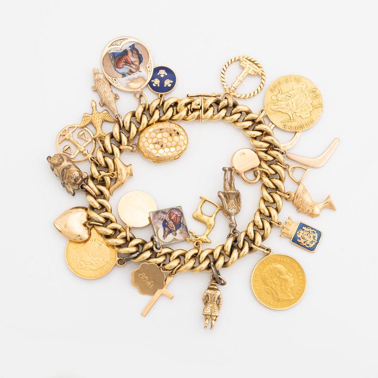 18K gold charm bracelet.