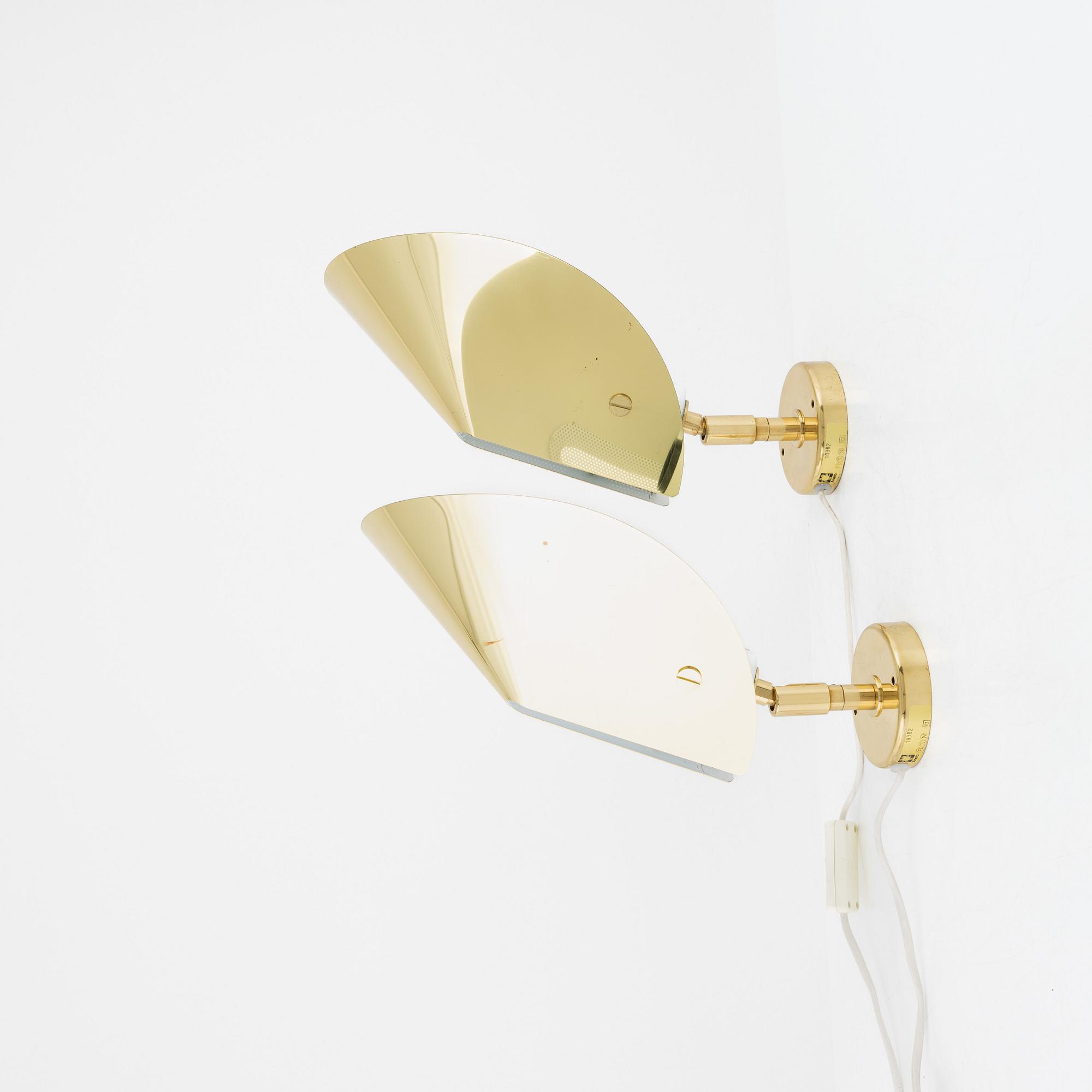 A pair of model 10302 brass wall lights, Aneta, Växjö.