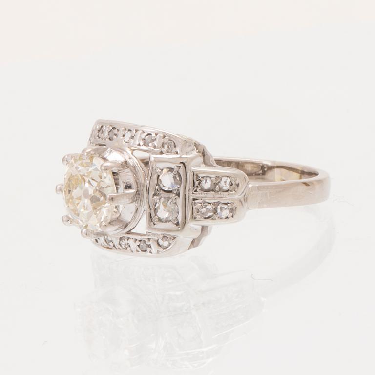An 18K white gold ring set with an old cut diamond and rose cut diamonds.
