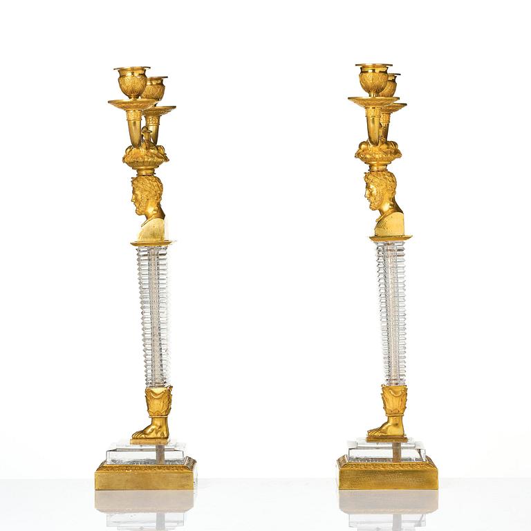A pair of Empire ormolu and cut glass two-branch candelabra, Paris, early 19th century.