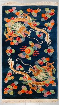 A rug from China, old, 208 x 122 cm.