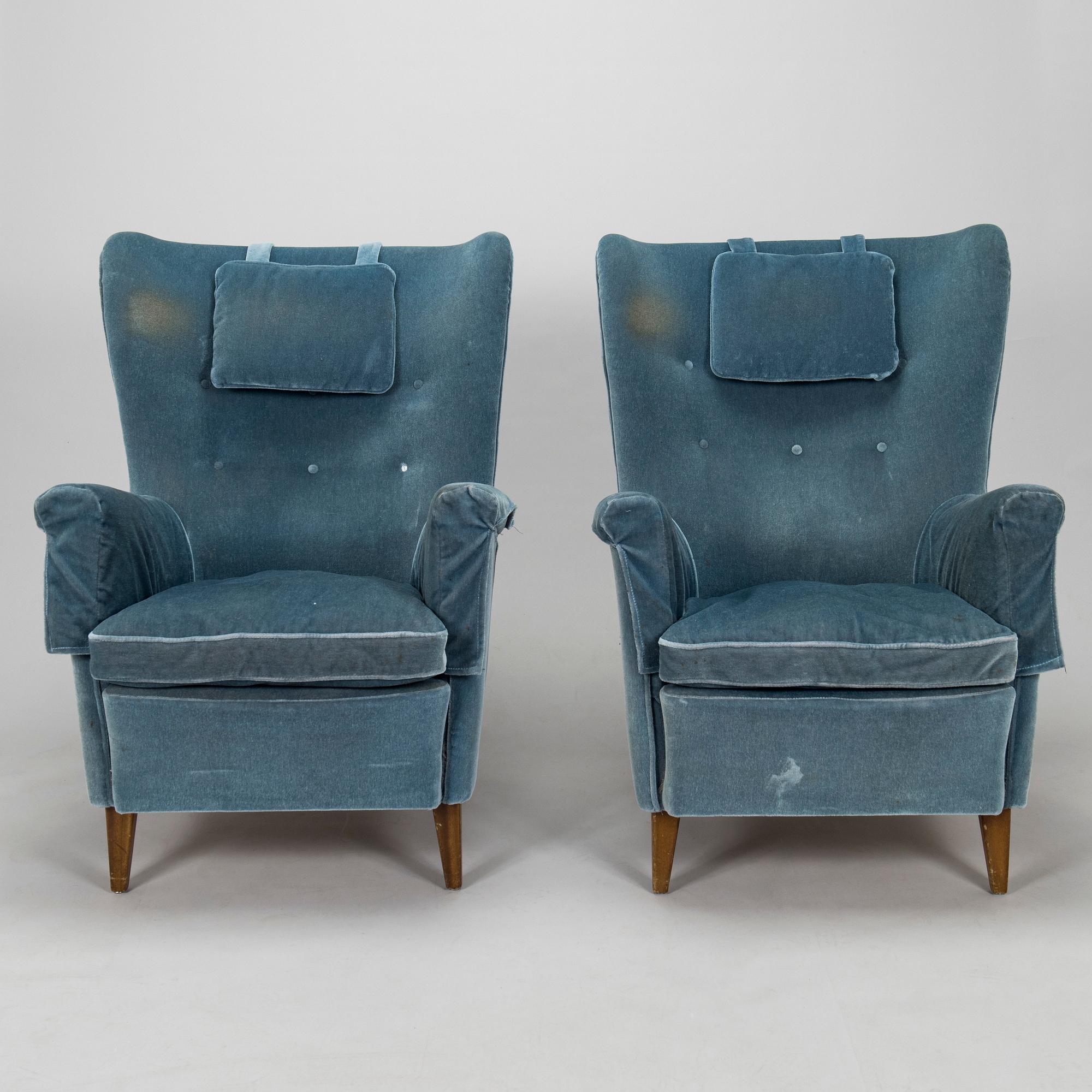 A pair of mid-20th century armchairs.
