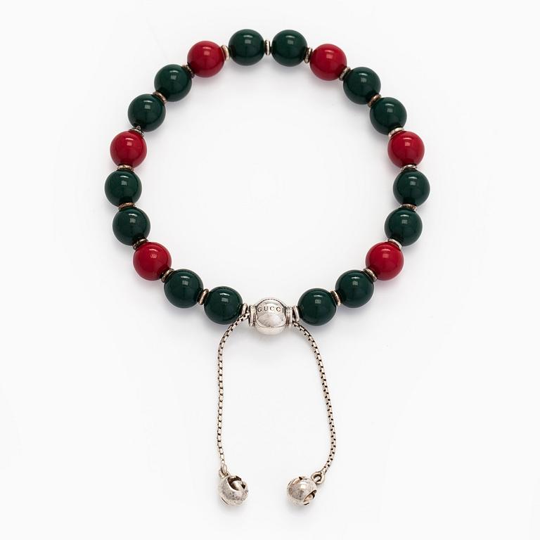Gucci, a 'Boule Britt"' bracelet.