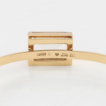 Armband 18K guld med en trappslipad syntetisk vit spinell, G. Dahlgren & Co Malmö 1969.