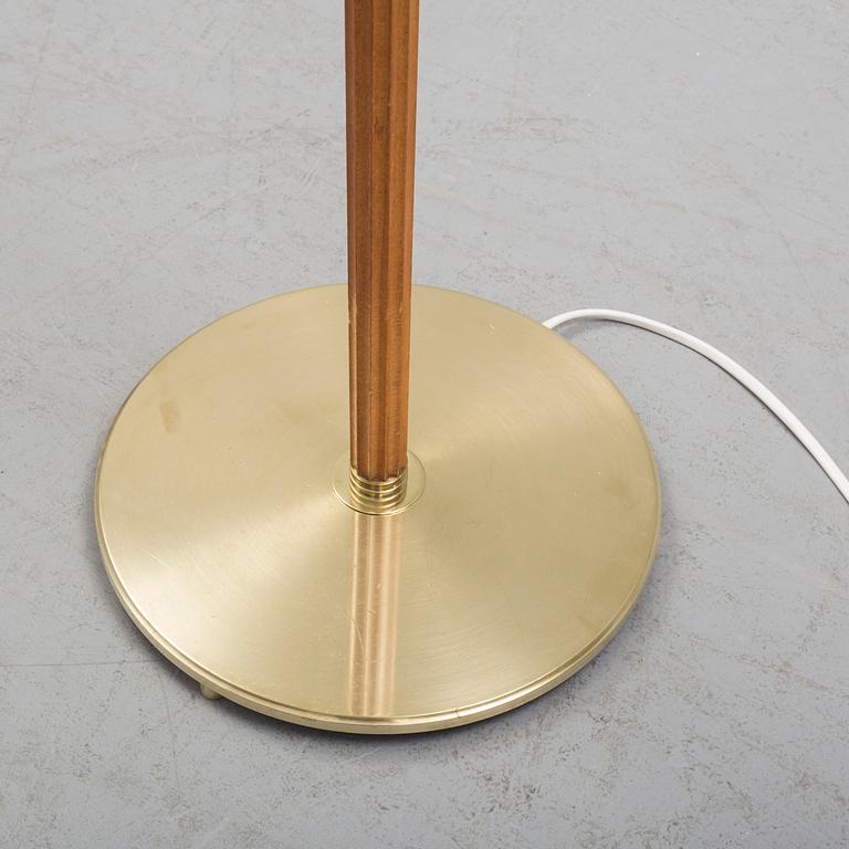 A Bergboms brass and beech standard light, 1940's.