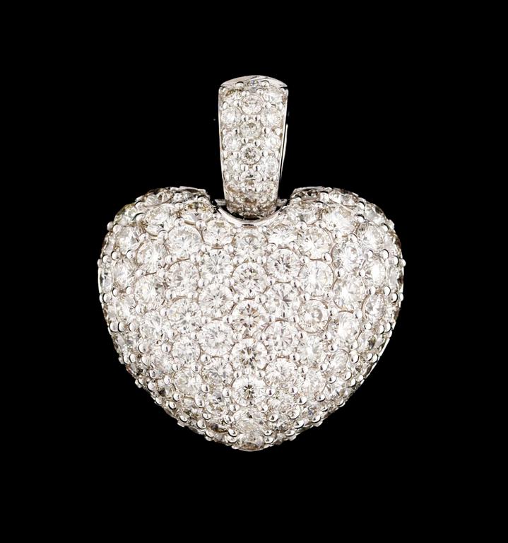 A heartshaped gold and diamond pendant.