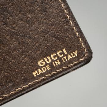 PLÅNBOK SAMT GLASÖGONFODRAL, Gucci.